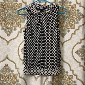 Sleeveless black and white work or dress shirt,